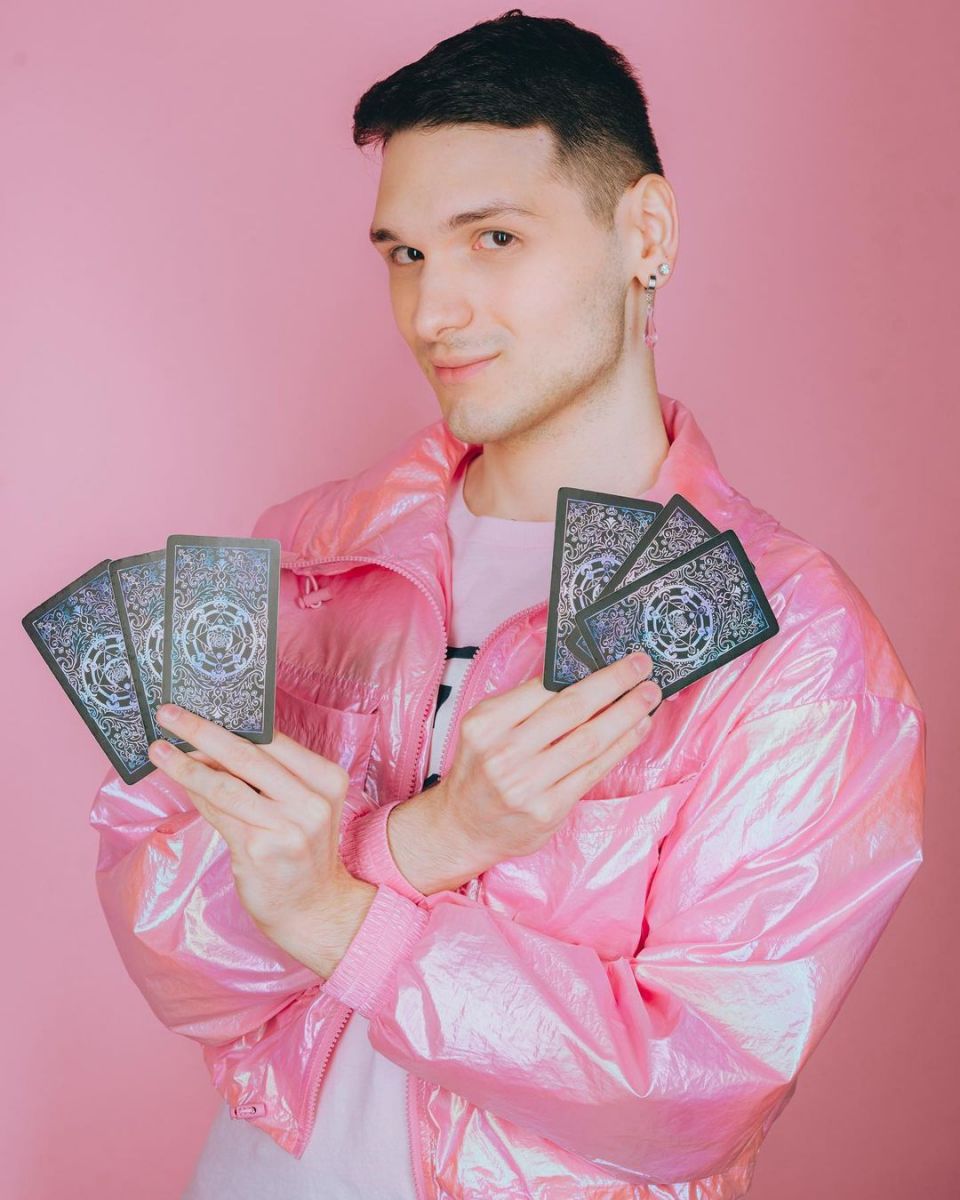 The "sassy psychic tarot reader"Â posing with tarot cards. 