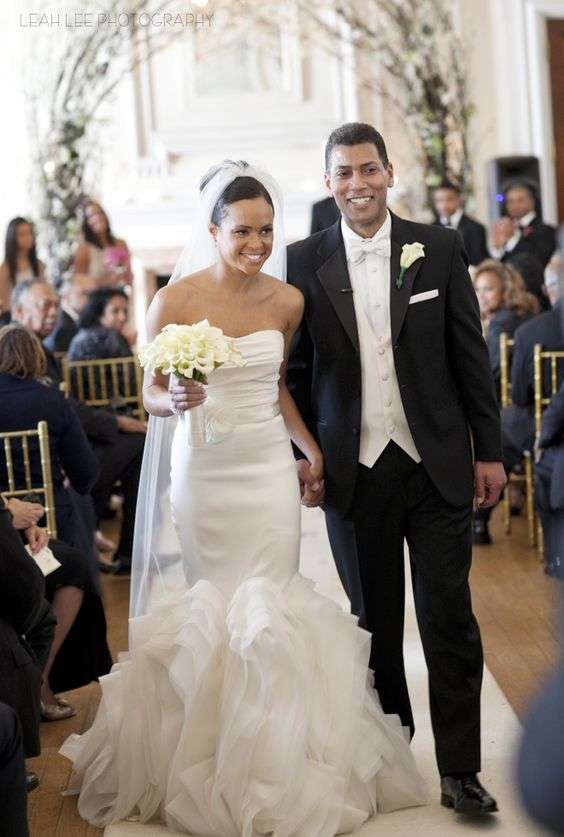 insey Davis walks down the aisle with her husband, Paul Roberts